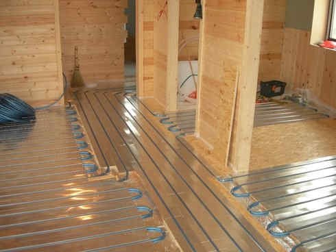 Photo of laying pipes for underfloor heating