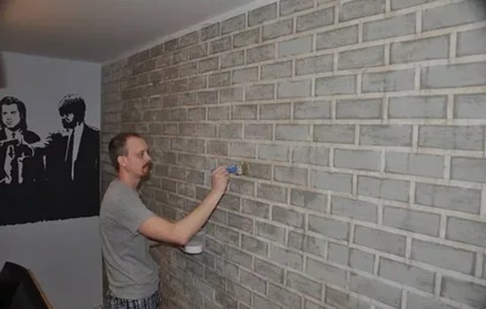 Laying tiles on a brick wall without plaster - stages of work