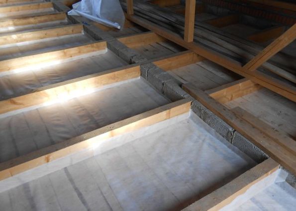 We start insulation of the attic floor with vapor barrier
